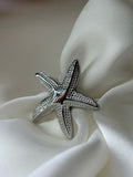 Anillo de estrellita de mar plateado